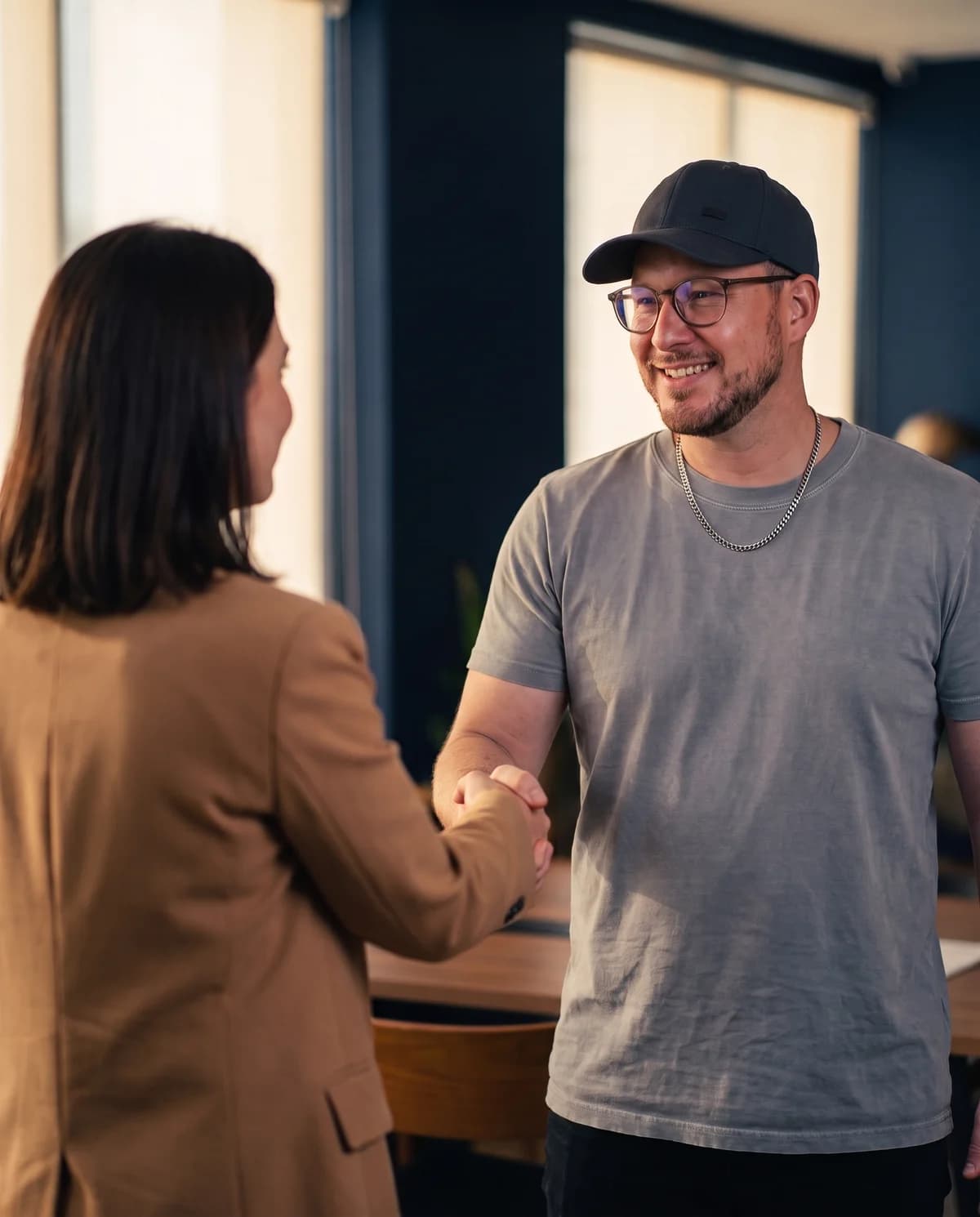 Mark Fulton shaking hands with a fellow entrepreneur